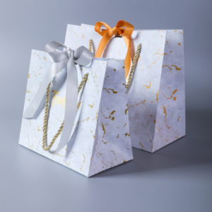Wholesale_luxury_euro_totes_paper-apparel-shopping-bags-handle_flat-custom_square_bottom_silver_foil_paper_bags-ribbon-mfg