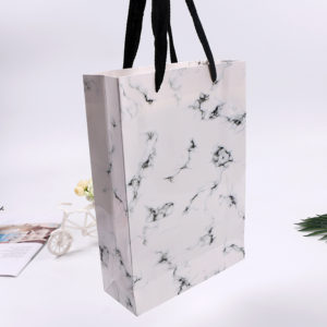Premium-Custom-Paper-Gifts-Bags-handle-with-flat-rope-white -merchandise-paper-shopping--bags-packaging-Wholesale