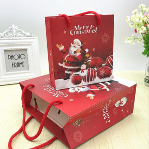 Wholesale-luxury-red-Christmas-popular-paper-shopping-bags-with-pp-rope -handles-wholesale-mfg
